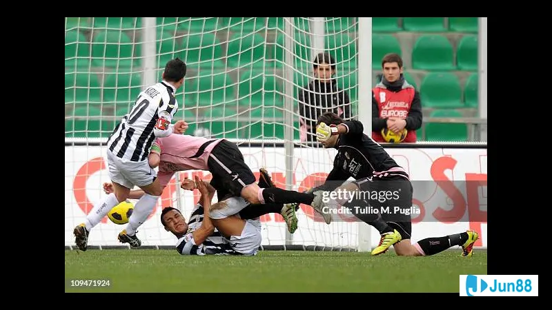 A Udinese player dribbles past a Palermo defender in a heated match A Udinese player dribbles past a Palermo defender in a heated match